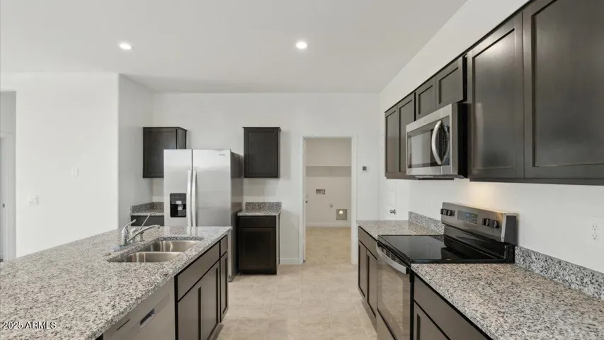 Photos are of a spec and may vary in color, interior selections and design