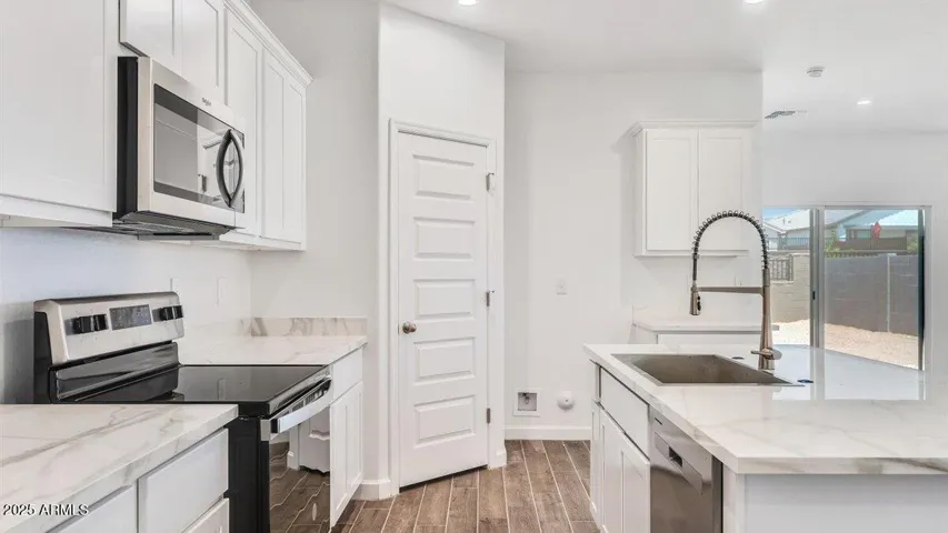 Photos are of a spec and may vary in color, interior selections and design
