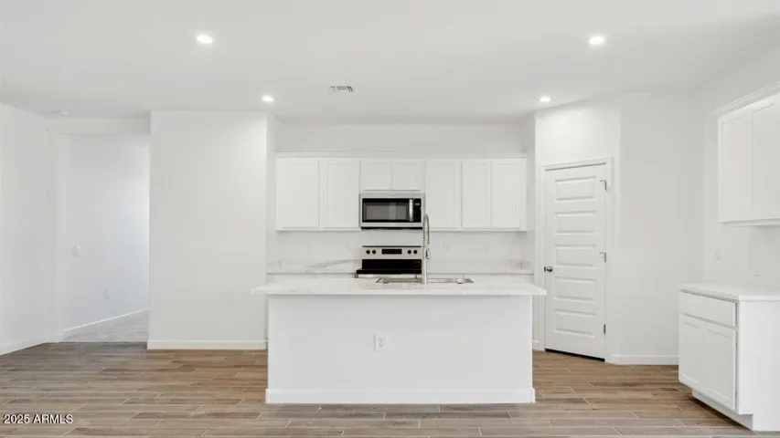 Photos are of a spec and may vary in color, interior selections and design