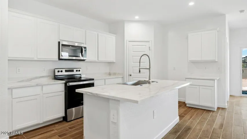 Photos are of a spec and may vary in color, interior selections and design