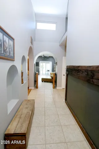 Private entry hall with shelving for your vases, plants or favorite statues.