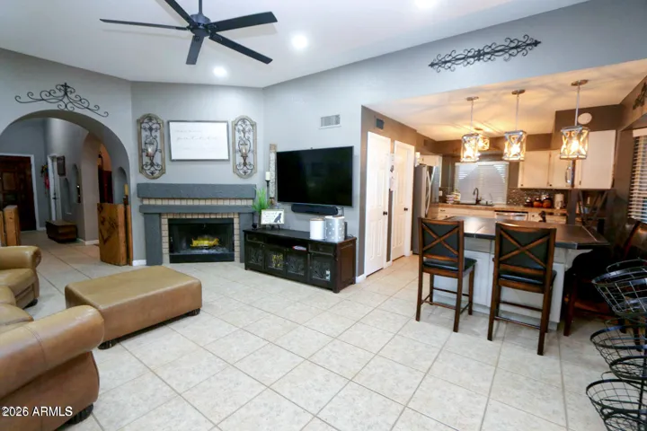 Family room is off of the kitchen and breakfast bar area. Wood burning fireplace.