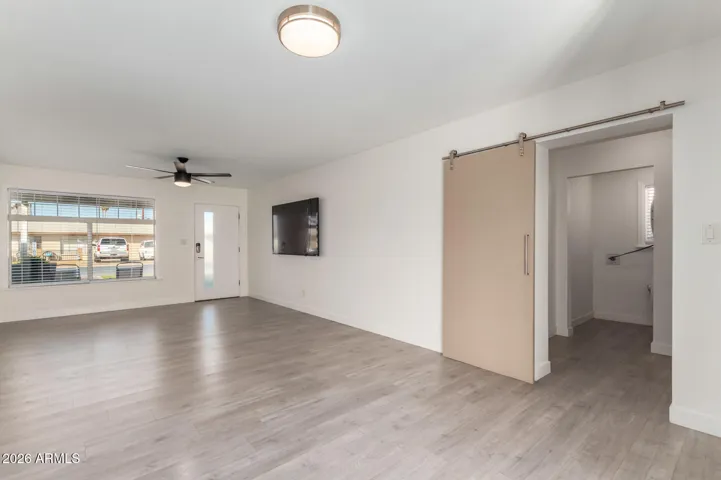 Living Room looking onto carport entry room and laundry room