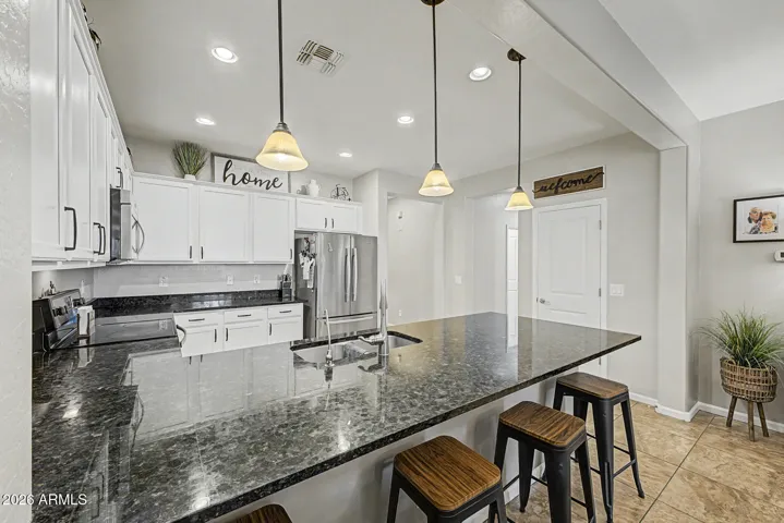 Kitchen area with nice granite counter tops