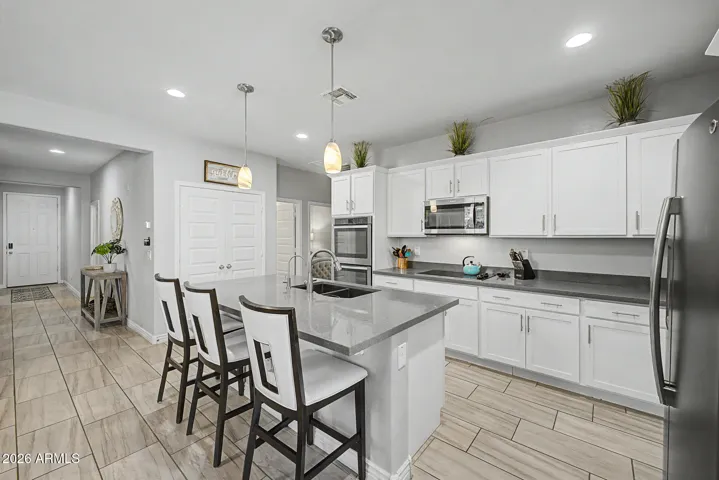 Open concept kitchen with double ovens and a large island perfect for entertaining!