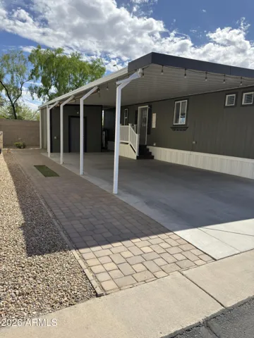 Carport with paver extension for entertaining