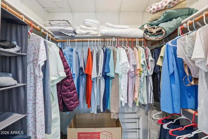 Walk-in closet has plenty of room for clothes and extra bedding