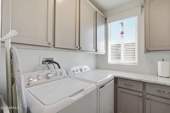 Lots of cabinets and storage in here. Plenty of counter space to fold laundry
