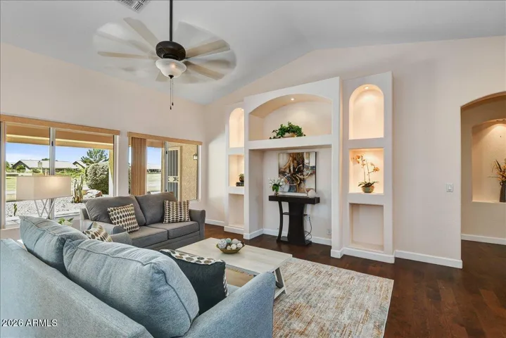 Another view of the living room with stylish built-ins