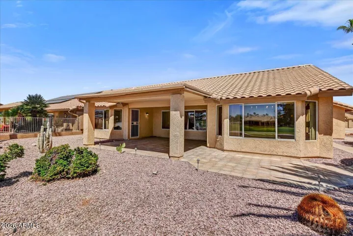 Step out to your backyard sanctuary, featuring a covered patio and a low-maintenance desert landscape and those golf course views!
