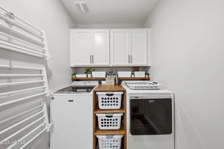 Custom-Made Bin Storage and Pull Down Drying Racks. Washer & Dryer Convey with home.