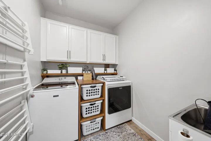 Custom-Made Bin Storage and Pull Down Drying Racks. Washer & Dryer Convey with home.