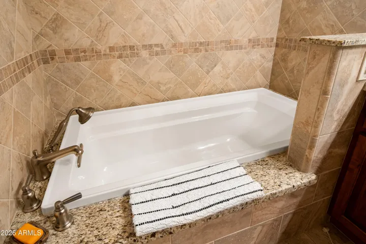 Its lengthy and deep! Perfect! But the design is brilliant. There are places to put your hands so that exiting is a breeze.
