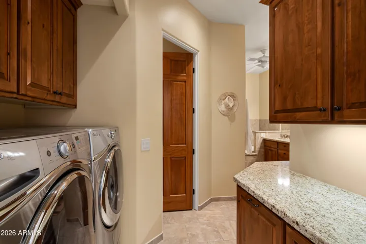 Quiet LG W/D with Laundry pullouts on the right. Nice built in cabinets.