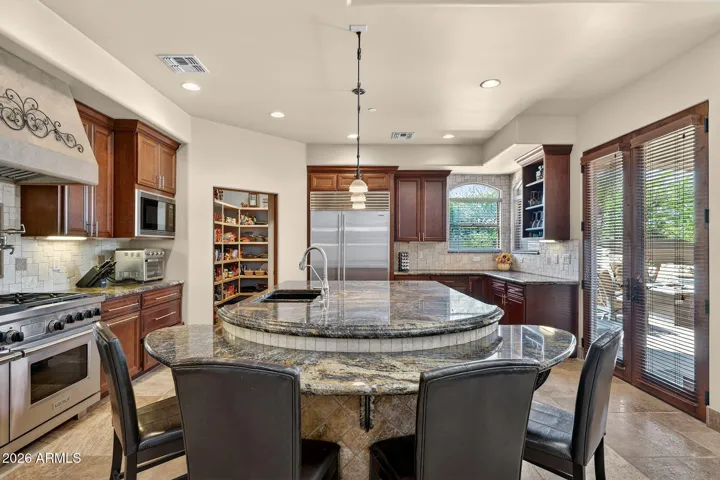 Informal dining around this curved island with granite