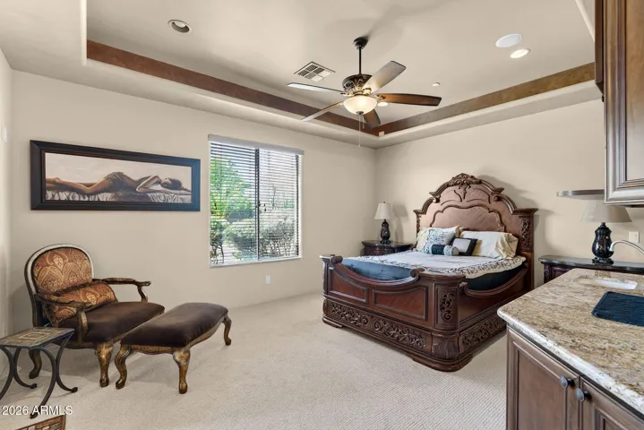 This downstairs bedroom offers a full ensuite, a fireplace, walk in closet, and wet bar.