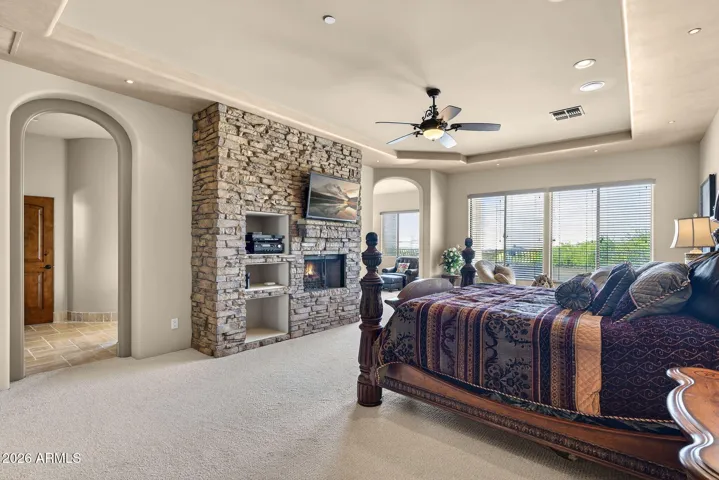 The Primary Suite is just stunning. Wide windows invite natural light, and the suite includes a private sitting area, bath, and view balcony