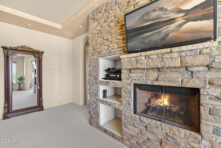 Stone trimmed gas fireplace and media center