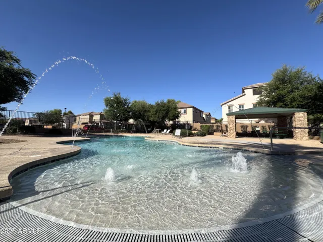 One of two resort style community pools is just steps away from the home.