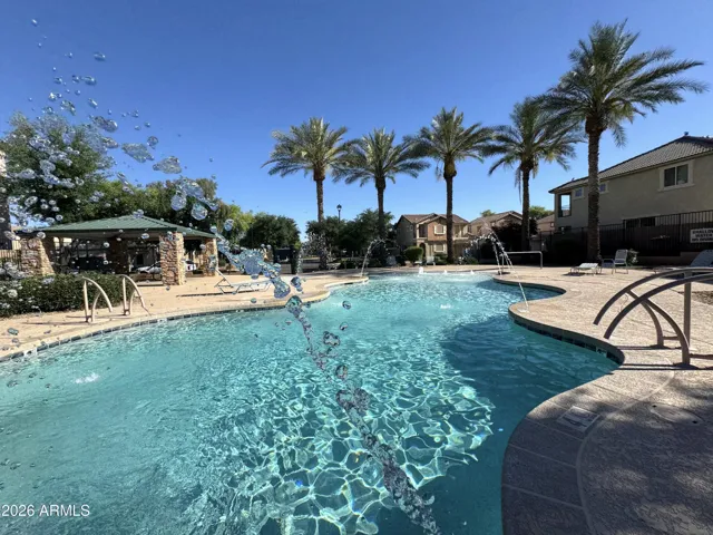 One of two resort style community pools is just steps away from the home.