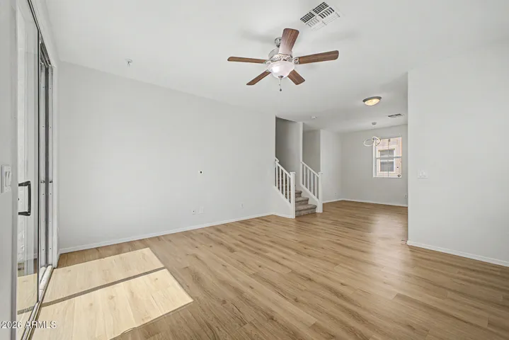 New flooring, large open and bright. Sliding doors open to fenced in patio/yard area.