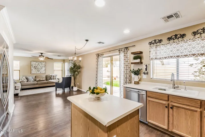 There is a large space for a dining table between the kitchen and great room