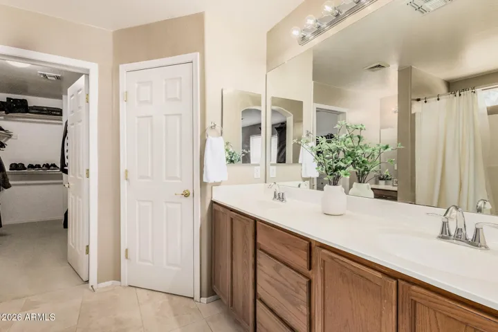 Primary bathroom - double sinks, private toilet room