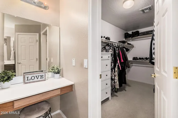Primary bathroom with separate Vanity area and mirror