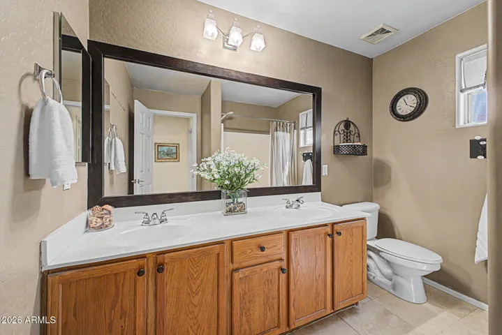 Upstairs hall bathroom with double sinks