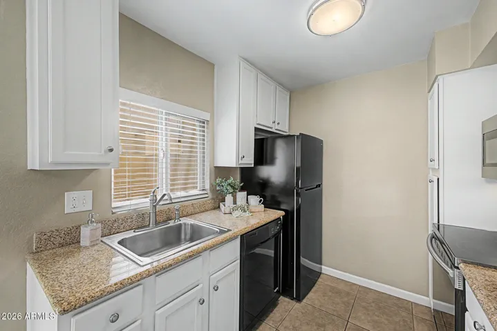 Remodeled Kitchen with Newer Appliances, Garbage Disposal, Light Fixtures, Faucet, and Granite Countertops.
