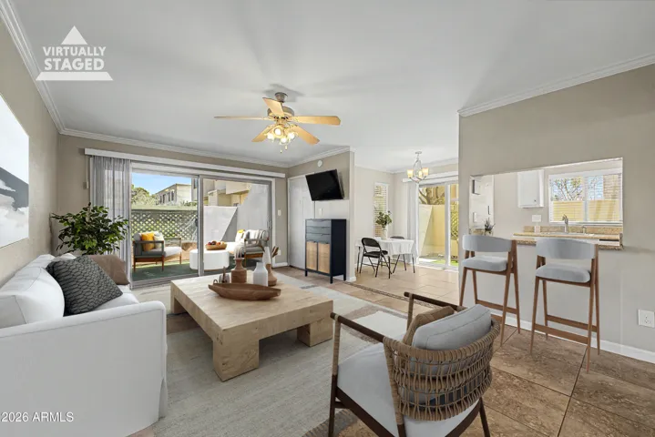 Virtually Staged, large open room allows for versatile seating arrangements. Breakfast Bar is an added bonus!