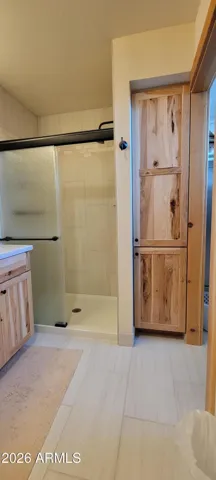 master bath with walk in shower and towl closet
