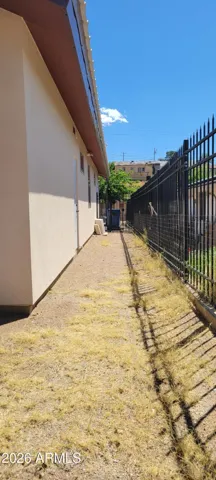 west side yard with a gate