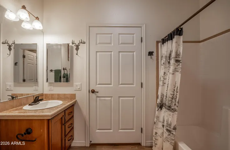 Bathroom One with Jack & Jill Doors from laundry room area to bedroom hallway