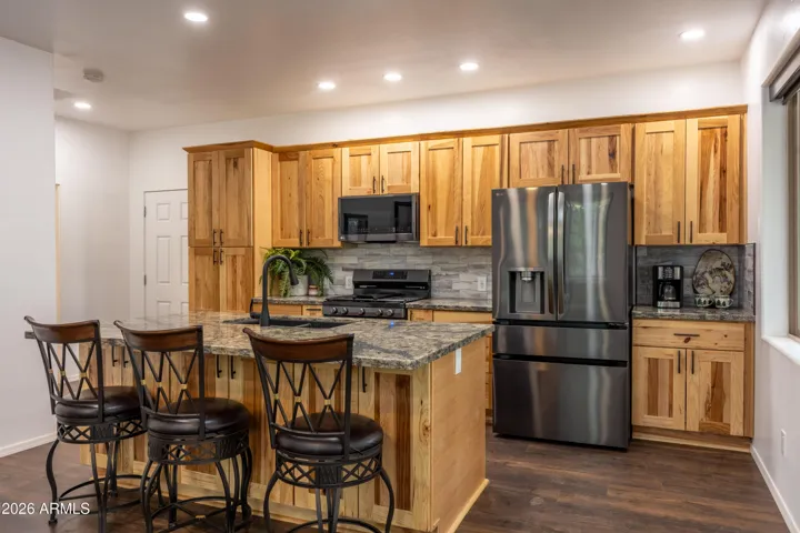 Beautiful Kitchen, stylish granite counter tops, stainless steel appliances, soft close cabinetry.