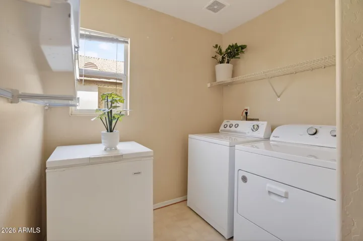 Laundry includes washer, dryer and small chest freezer