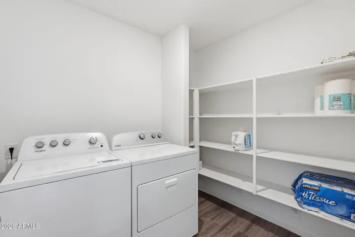 Laundry Room w/ Ample Shelving