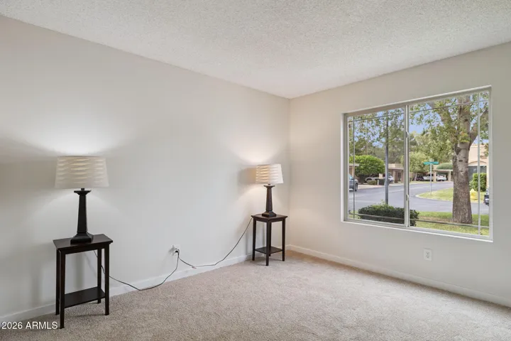 Second bedroom with large window.