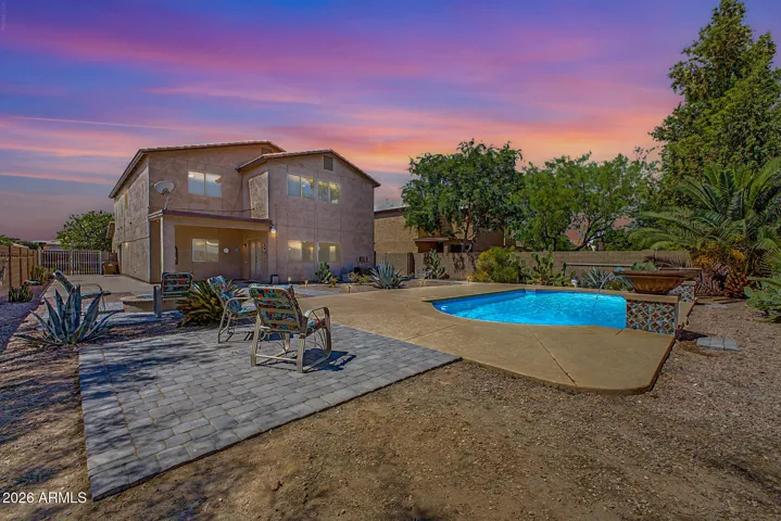 Huge yard with pavers, bbq stubs, pool heater, & so much more!