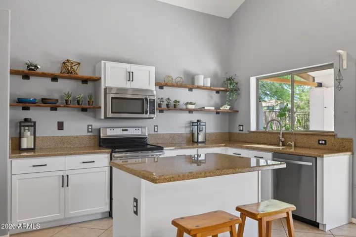 The recently remodeled kitchen is light, bright, and welcoming.