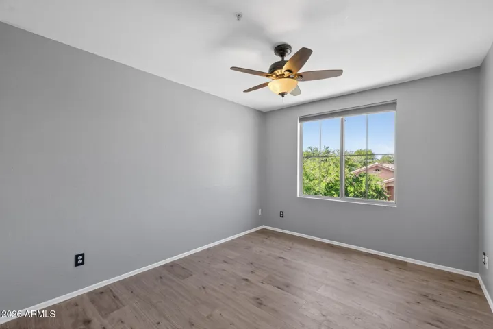 The second of two secondary bedrooms upstairs.