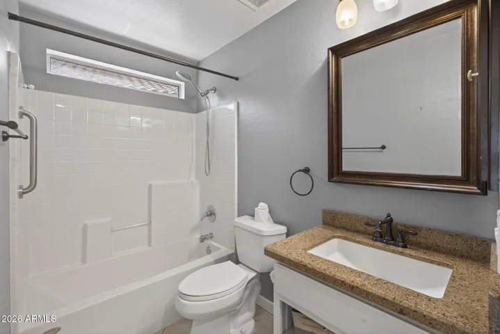The en-suite main level bathroom that also functions as a powder room.