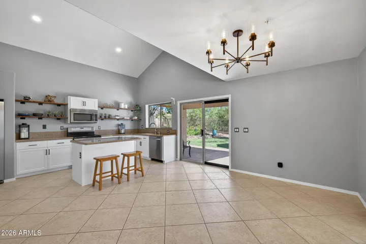 Extra island seating, ample counter space, and contemporary finishes make hosting a breeze.