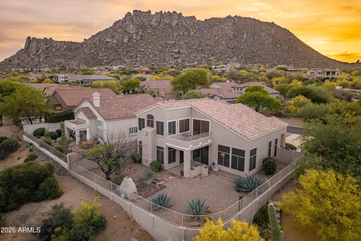 Stunning aerial view showcasing a premier setting beneath Troon Mountain, where desert landscape, privacy, and mountain views come together.