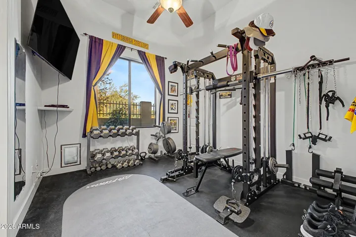 bedroom utilized as a weight room connects to the jack and jill bathroon