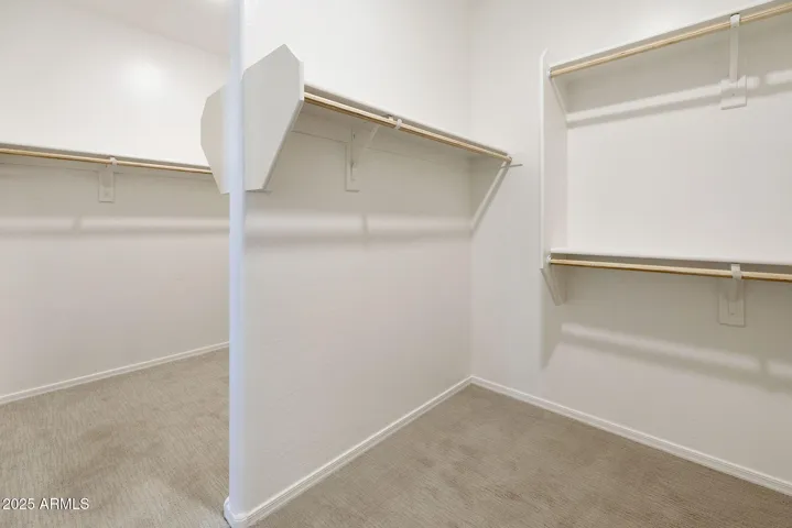 LARGE OWNERS CLOSET THAT IS A MIRROR IMAGE OF EACH OTHER ON EACH SIDE. LOTS OF STORAGE.