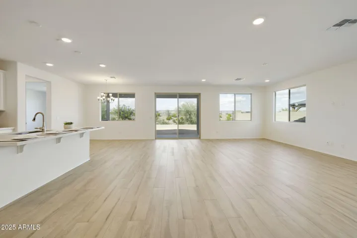BEAUTIFUL WOOD PLANK TILE FLOORING THROUGHOUT THE HOME MINUS THE BEDROOMS.