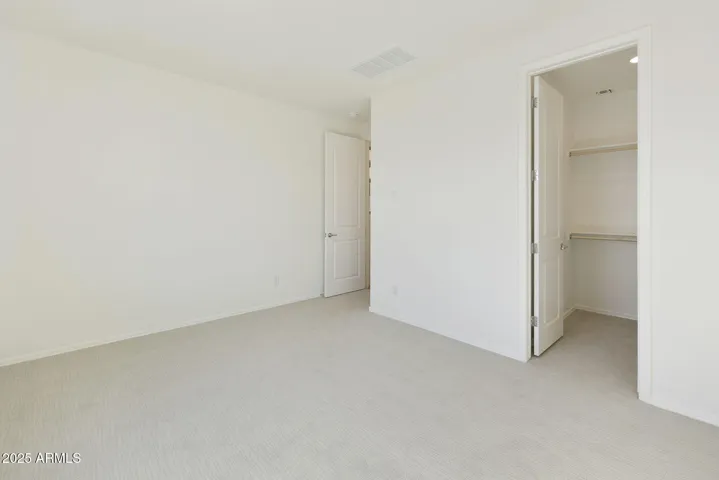 HALL BEDROOM WITH WALK IN CLOSET