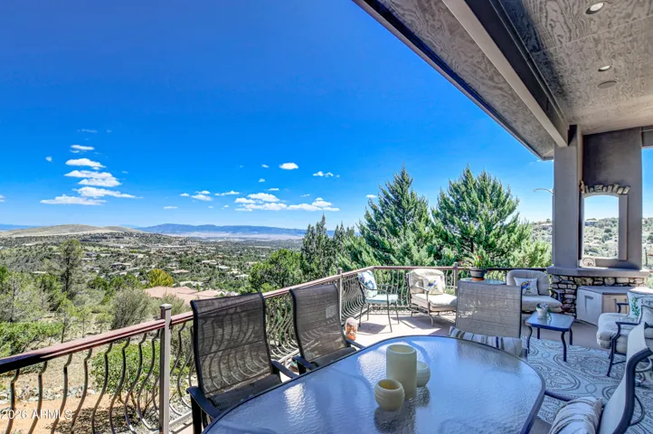 Step outside and enjoy the expansive deck enhanced with custom metal railing