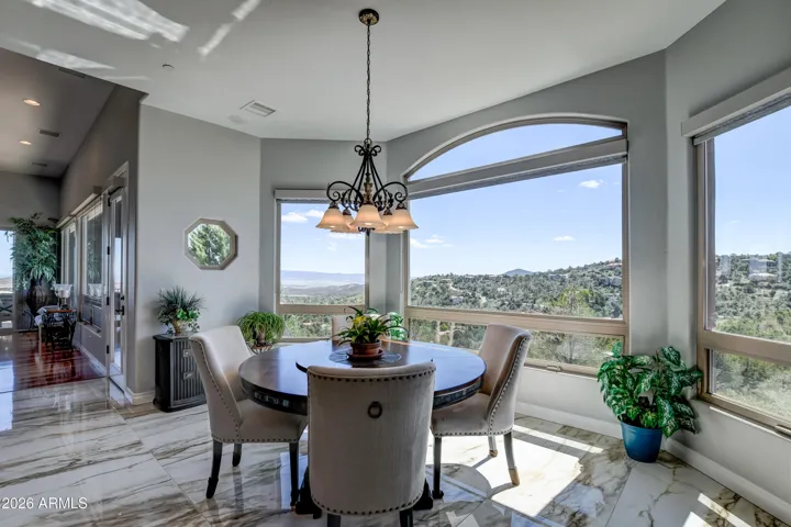 Light and bright area with a custom hexagon window to highlight and maximize every view from this dining area